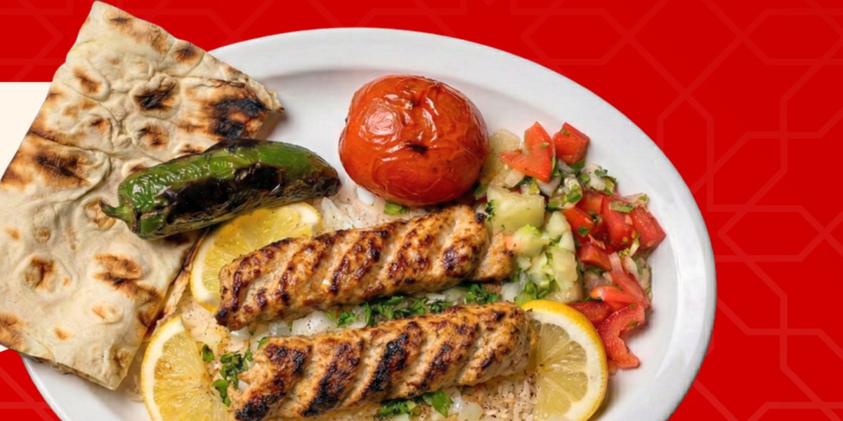 Chicken Lula Kabob plate with rice, salad, lavash, grilled tomato and pepper